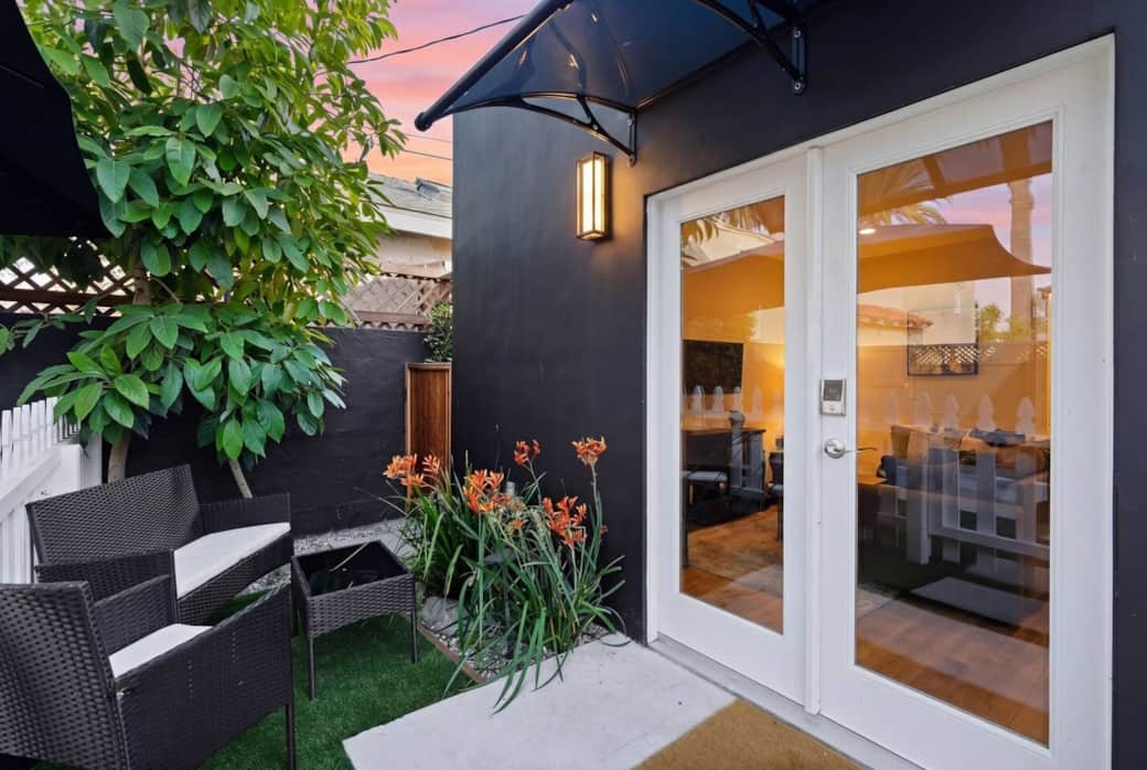 Cozy private patio w/ French doors for easy access to the living room, lounge seating, and greenery. Cozy private patio w/ French doors for easy access to the living room, lounge seating, and greenery.