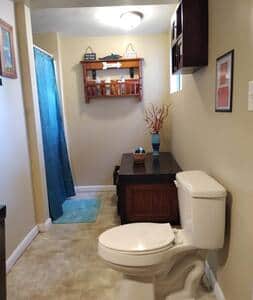 Large ensuite bathroom in the bedroom is stocked with towel sets, essentials and paper products.