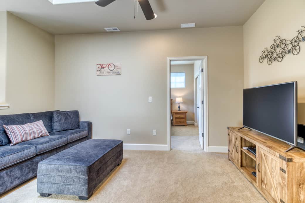 Loft flex space with queen sofa bed and access to upstairs bedrooms