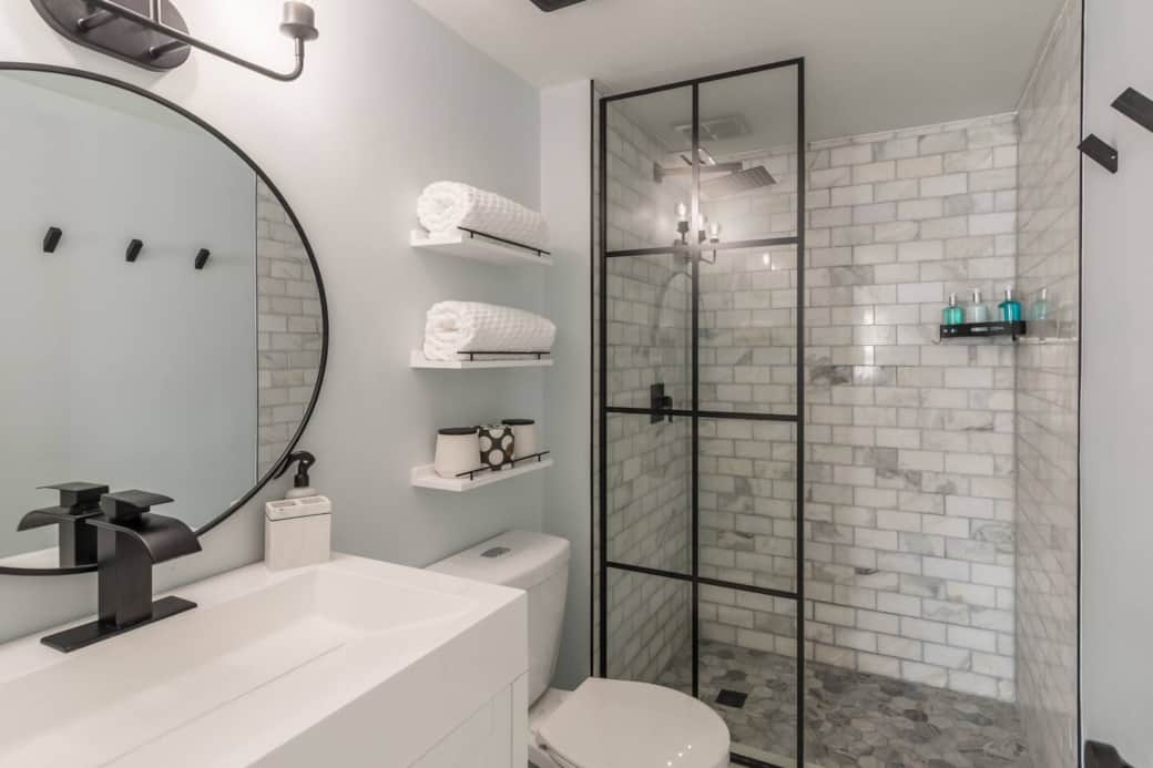 You might just want to spend all day in this stunning master bathroom.  Marble tile and all of the essentials make this bathroom perfect for your stay. 