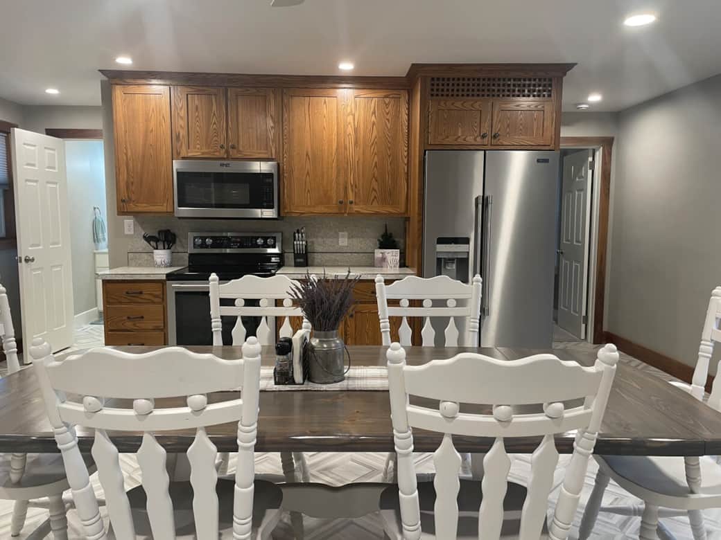 Bathroom two is to the left of the kitchen and bedroom and bathroom one are on the right of the kitchen. 