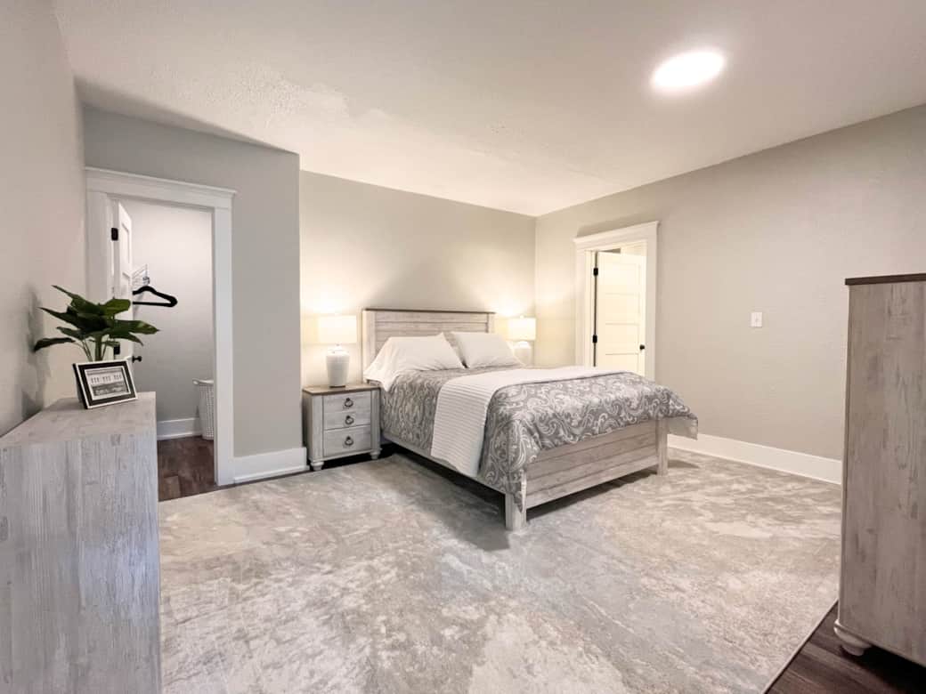 The bedroom features a queen bed.