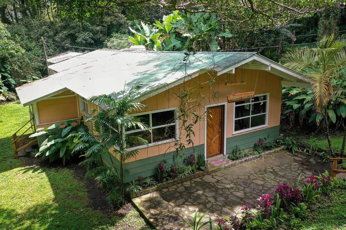 Main entrance surrounded by lush gardens and cloud forest.