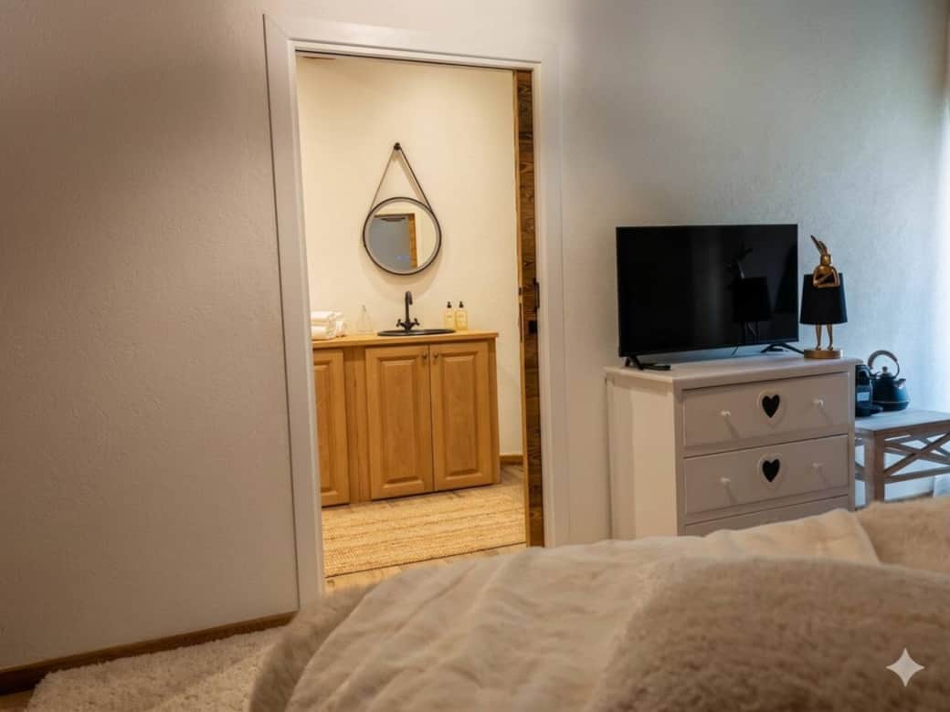 Ensuite bathroom with walk-in shower, directly accessible from the bedroom