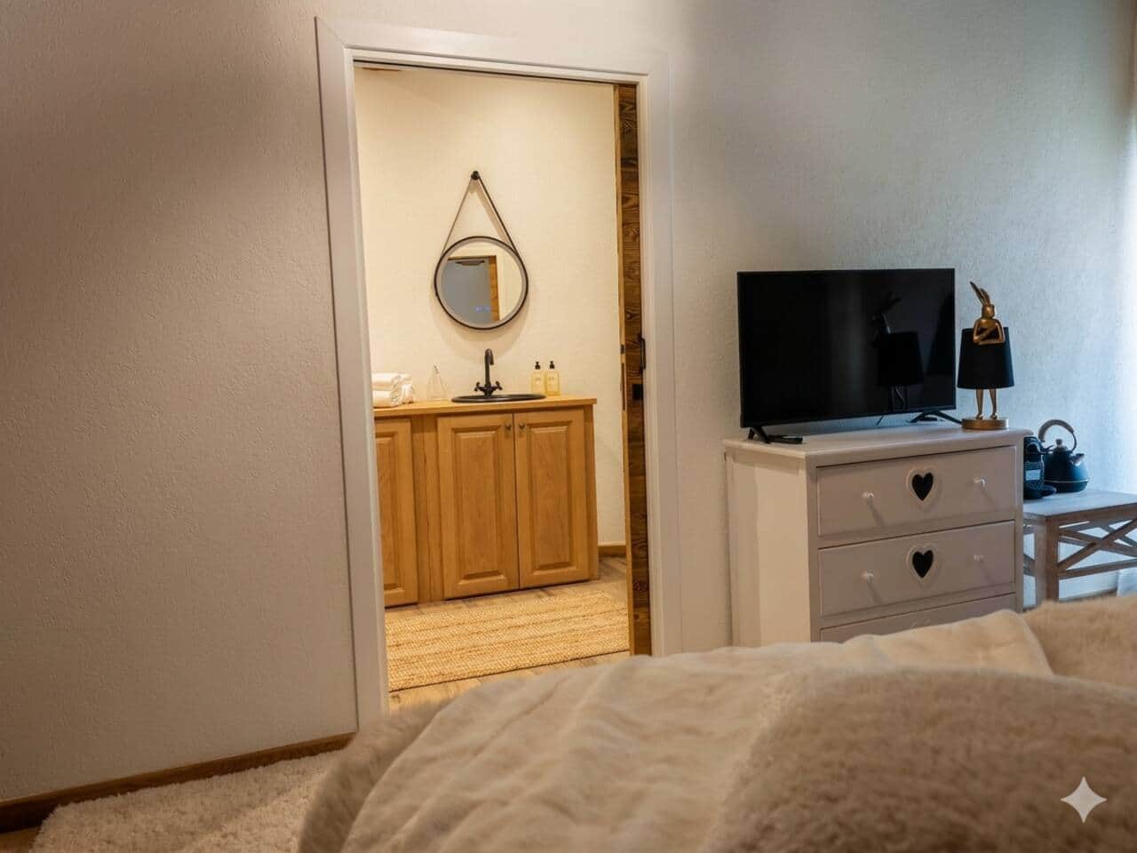 Ensuite bathroom with walk-in shower, directly accessible from the bedroom