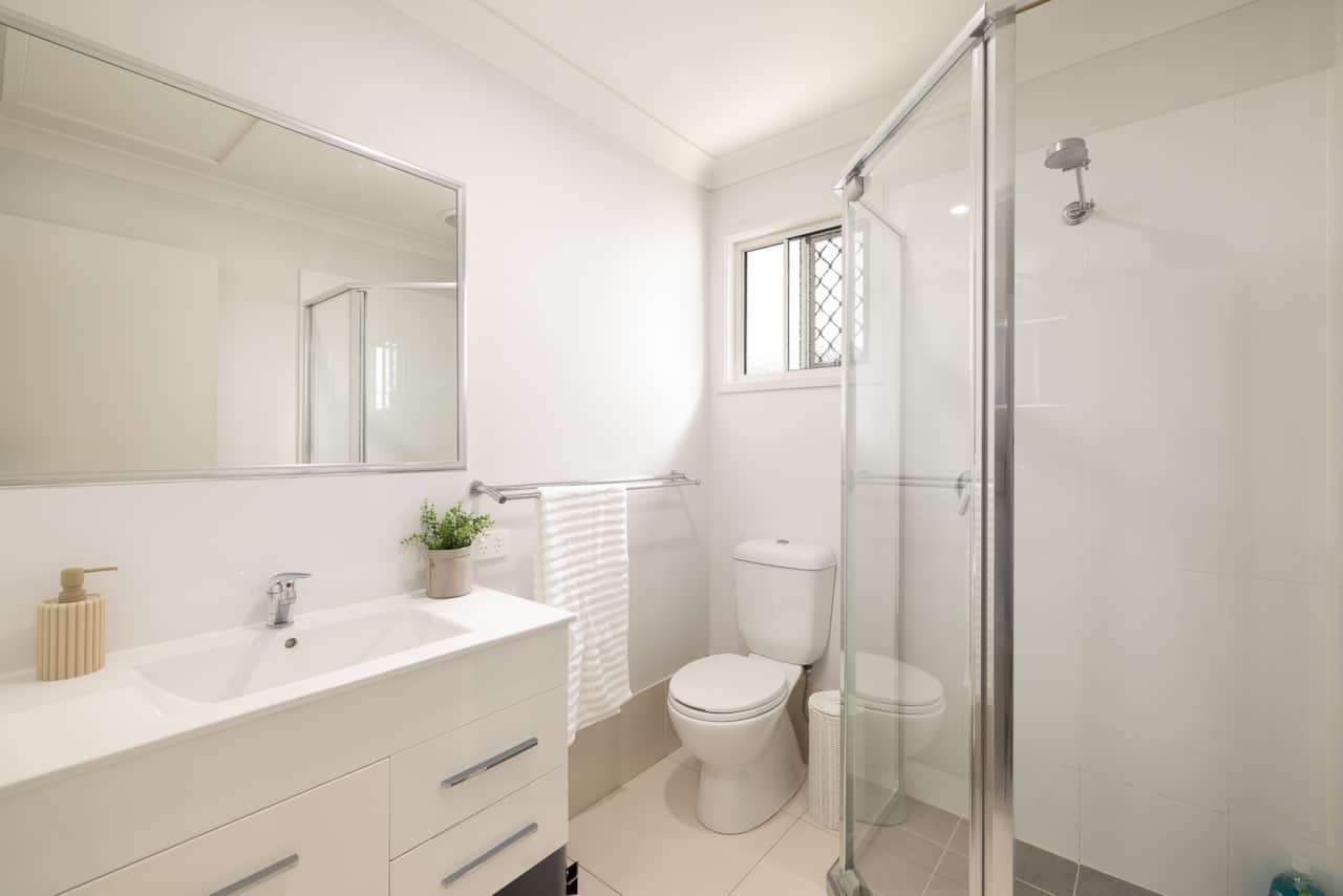 Bathroom: Stylish bathroom with walk-in shower, vanity, and clean finishes 