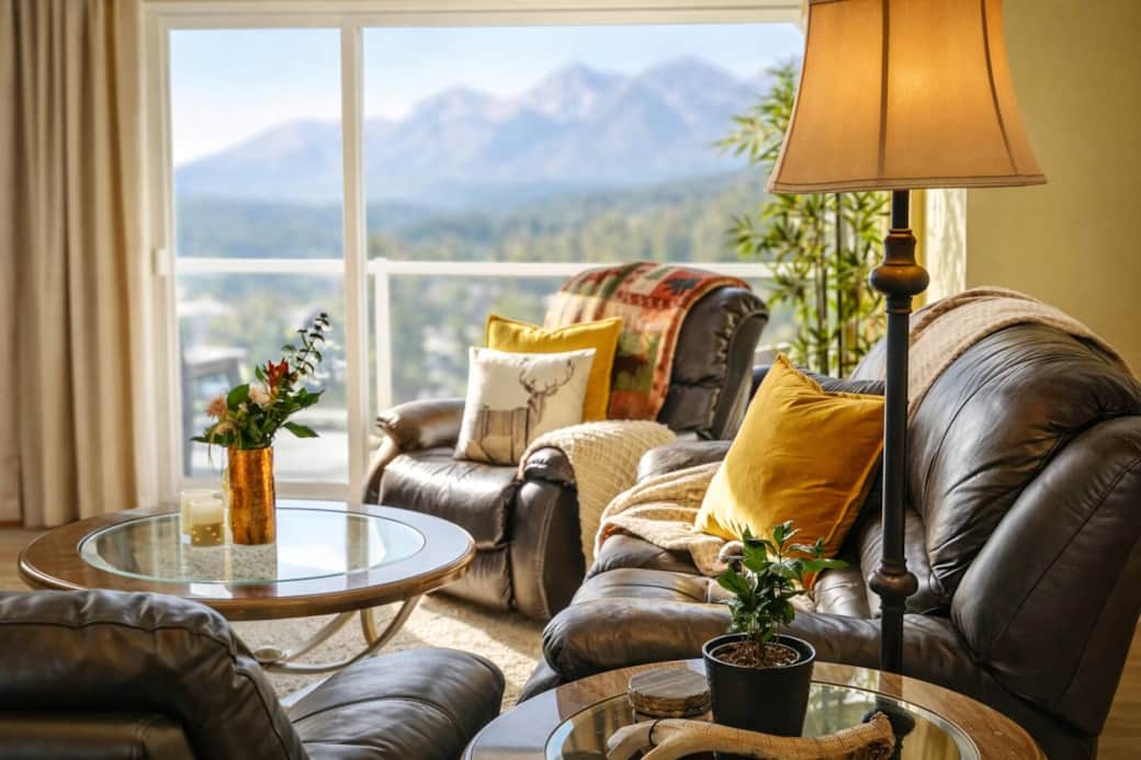 Feel right at home in this warm living room with access to the balcony overlooking the lake and mountains.