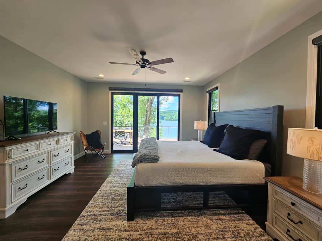 King main level primary suite, remote controlled blinds, access to main level deck 