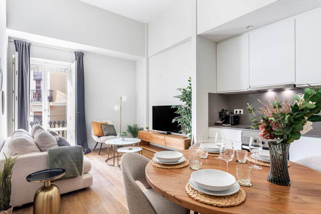 Bright and elegant space with city skyline views, perfect for relaxing or working.