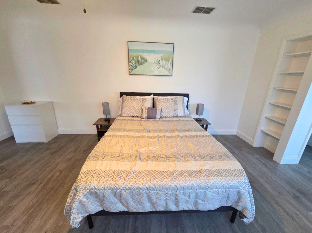 Comfortable queen bed with premium linens, soft pillows, and elegant nightstands. Lakeland, FL