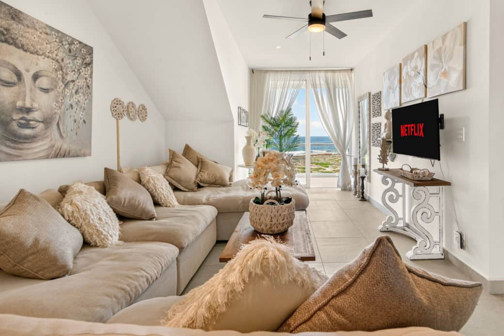 Enjoy breathtaking Caribbean Sea views from the living room, with unforgettable tropical sunsets.