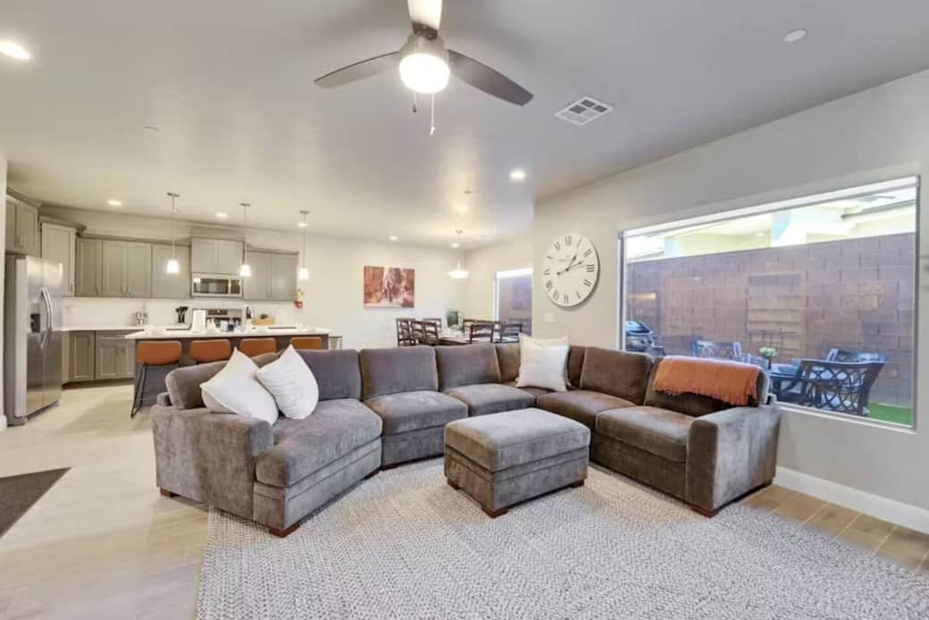 View of the large family room, kitchen, dinning area and outside table and chairs with BBQ