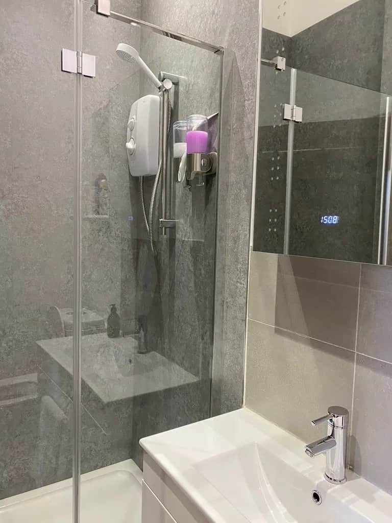 A spacious, spotless full-sized shower room
