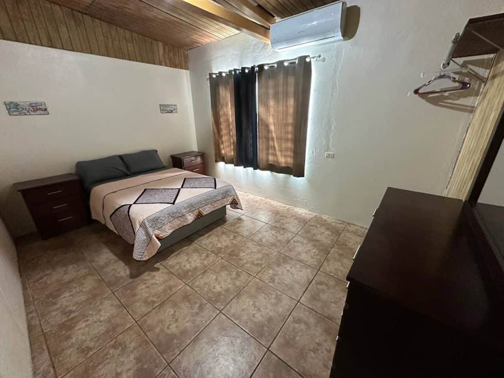 1 bedroom with 1 full size bed and an inverter air conditioned.