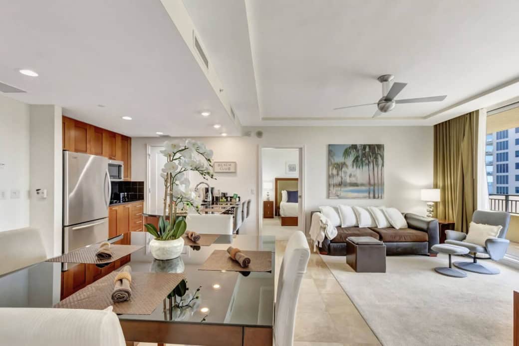 Spacious living room with smart TV, queen size pull out couch and private balcony 