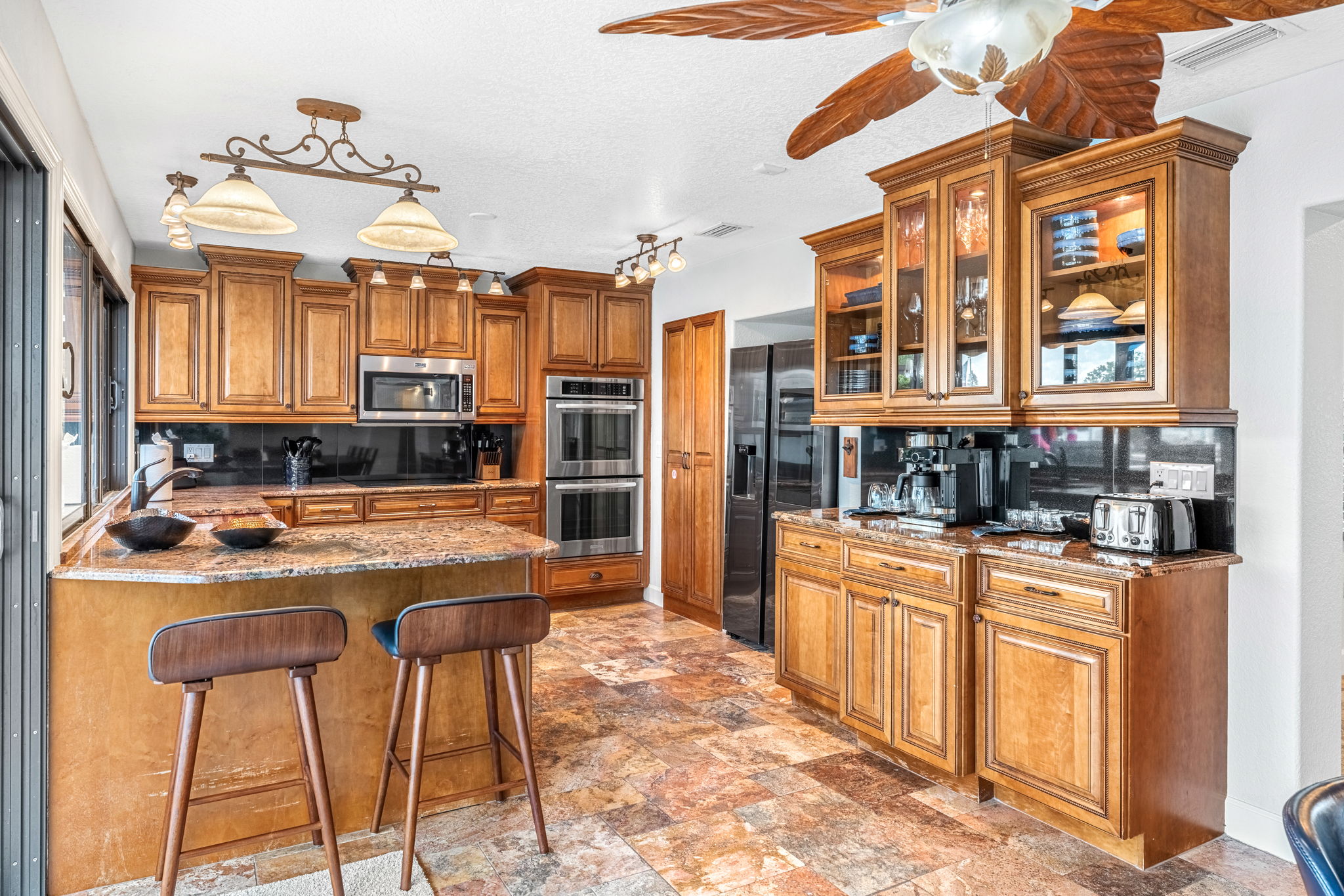 Create culinary masterpieces in this well-equipped kitchen with high-end appliances.