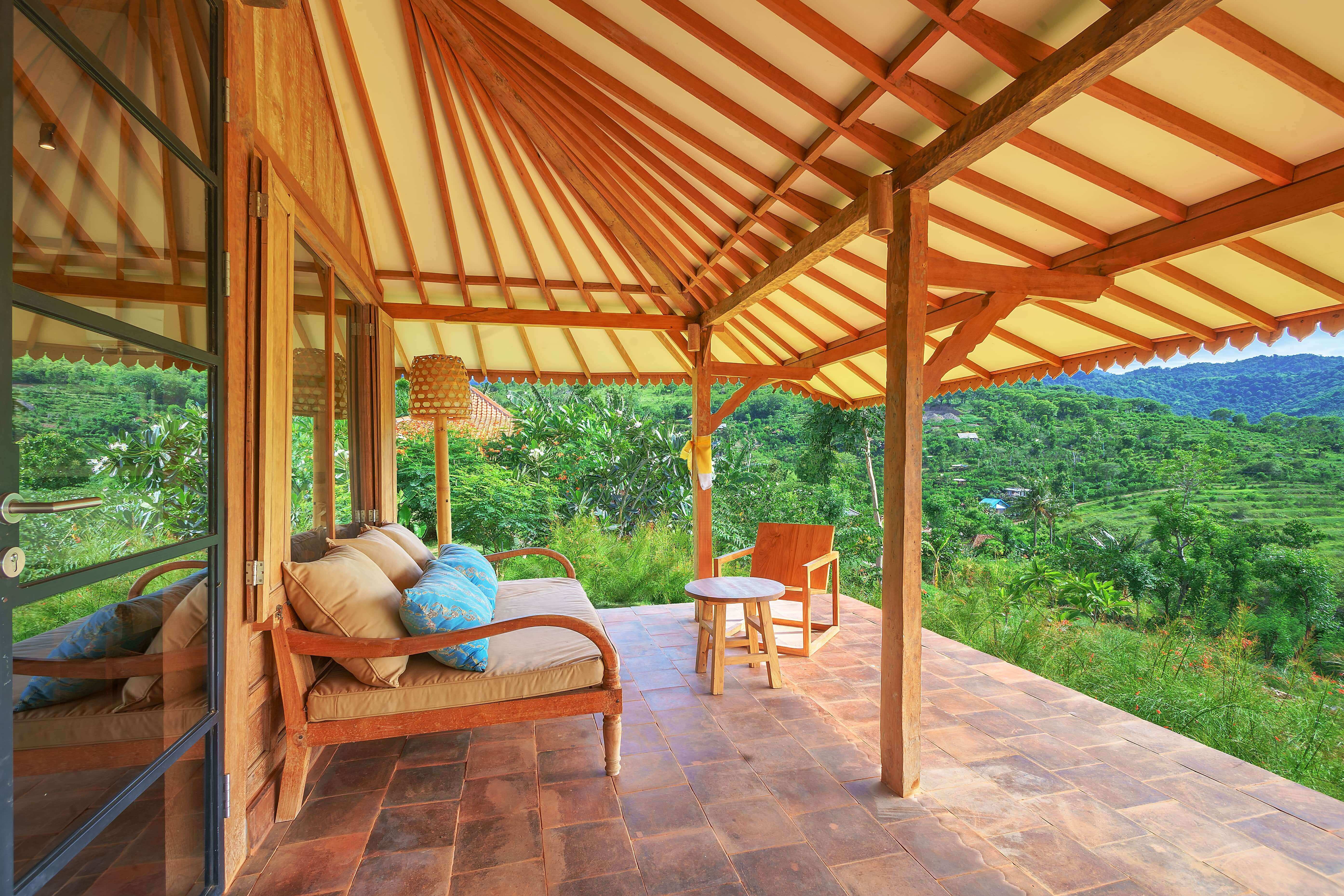 Elegant Cempaka Joglo house with traditional joglo roof and lush garden