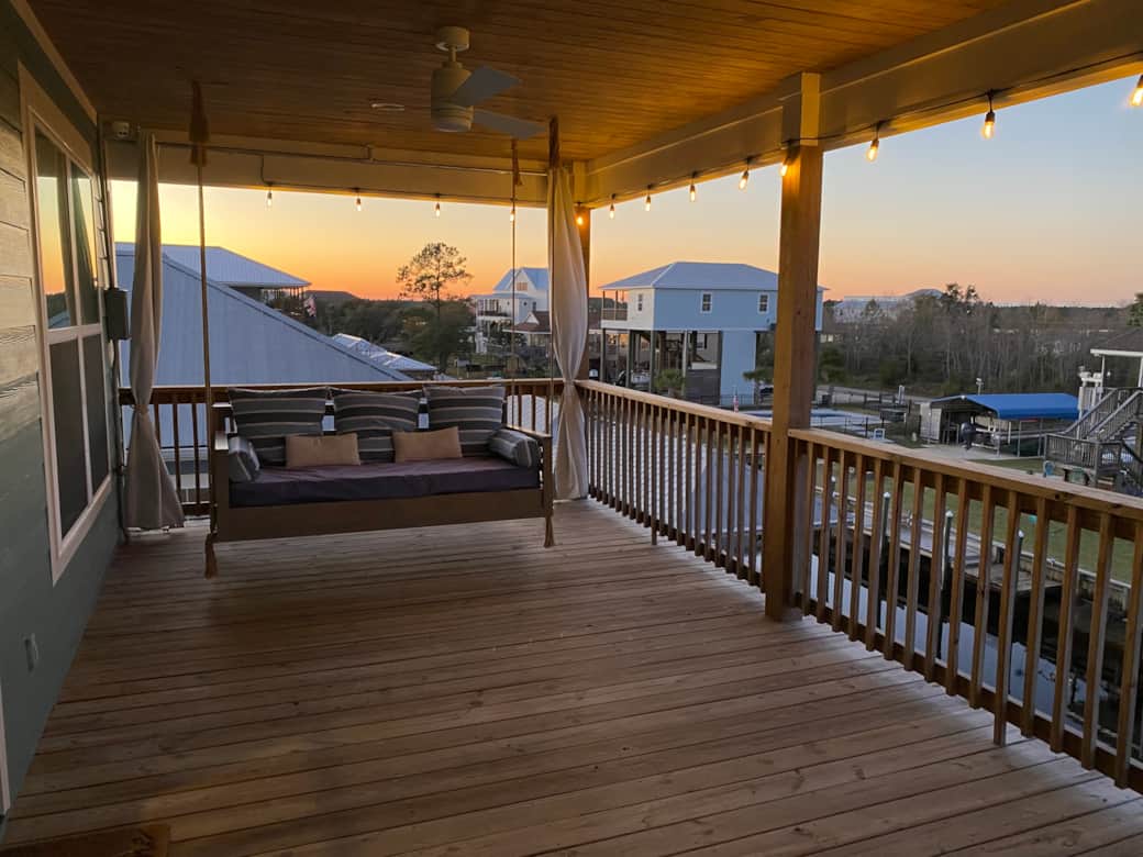 Swing bed sunset with porch lights