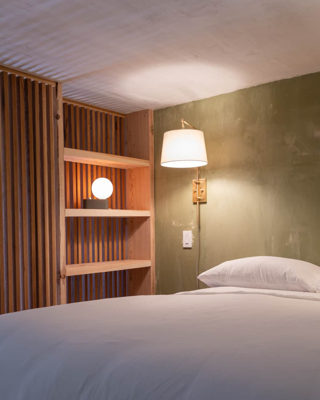 Bedside shelves and reading lamp