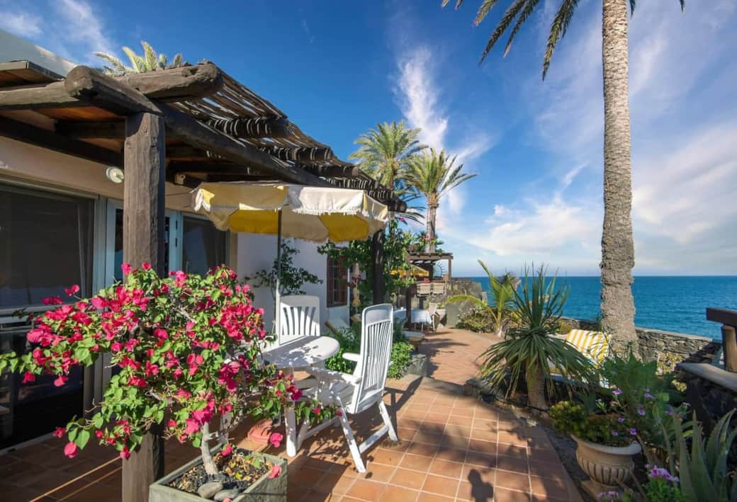 Rocadelmar1 garden terrace flowers palm tree view of middle terrace Rocadelmar1 garden terrace flowers palm tree view of middle terrace