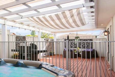 Outdoor area with heated spa