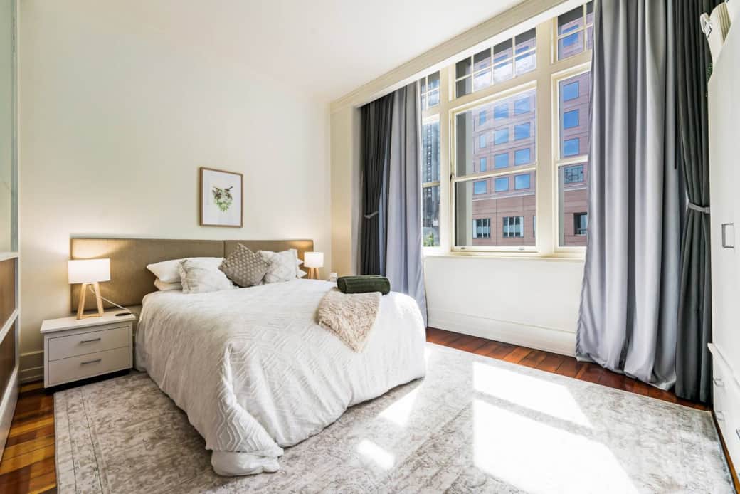 Bedroom with queen bed and wardrobe