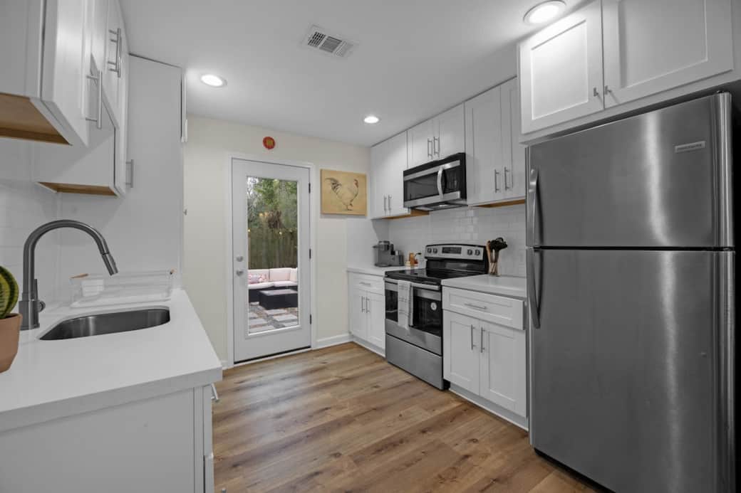 Enjoy a bright, fully equipped kitchen with stainless steel appliances, modern cabinetry, and counter space. Perfect for preparing meals, quick breakfasts, or longer stays where comfort and convenience matter.
