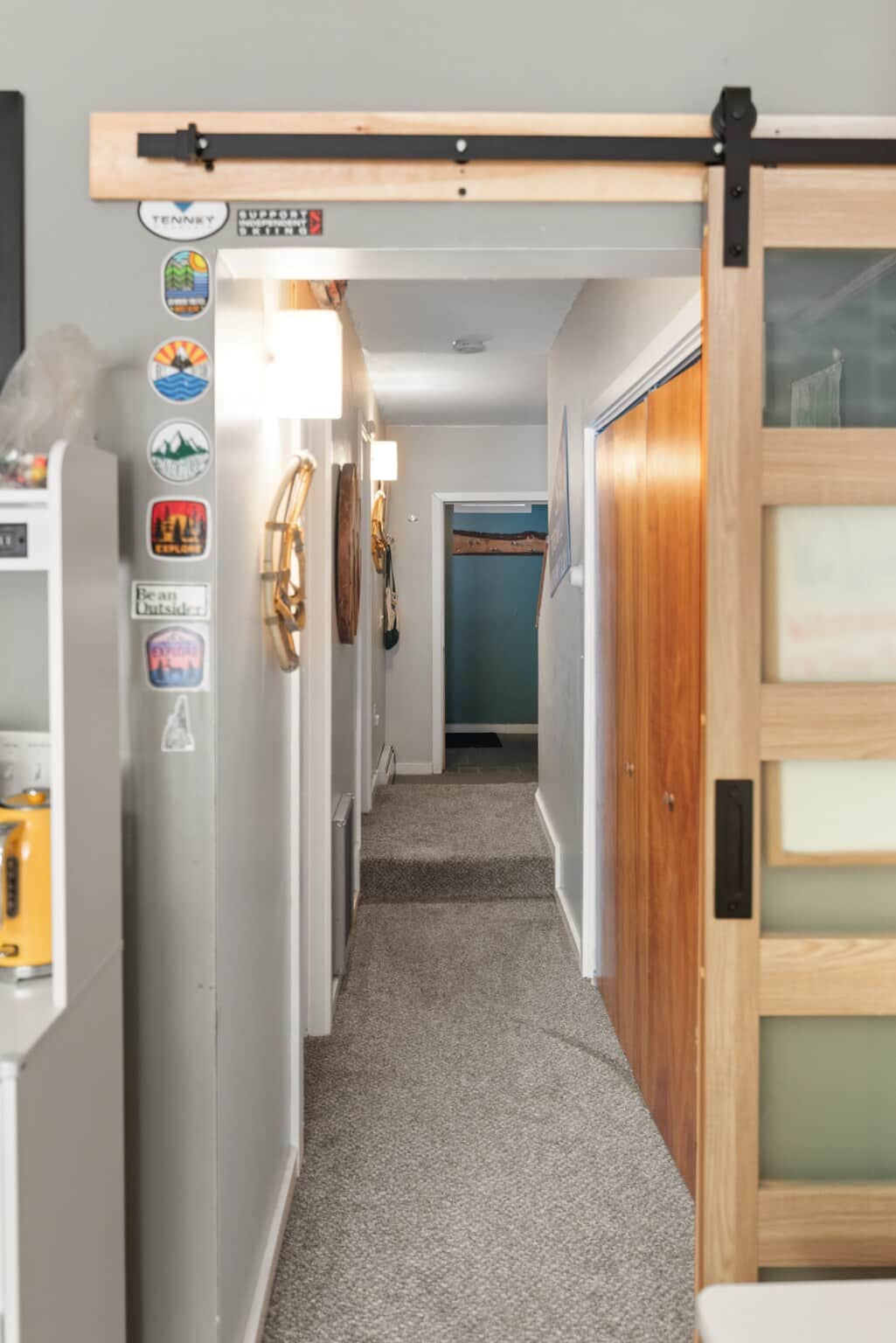 From Kitchen/Dining area looking down hallway to mudrooms.  1/2 bath on left, laundry room on right. 