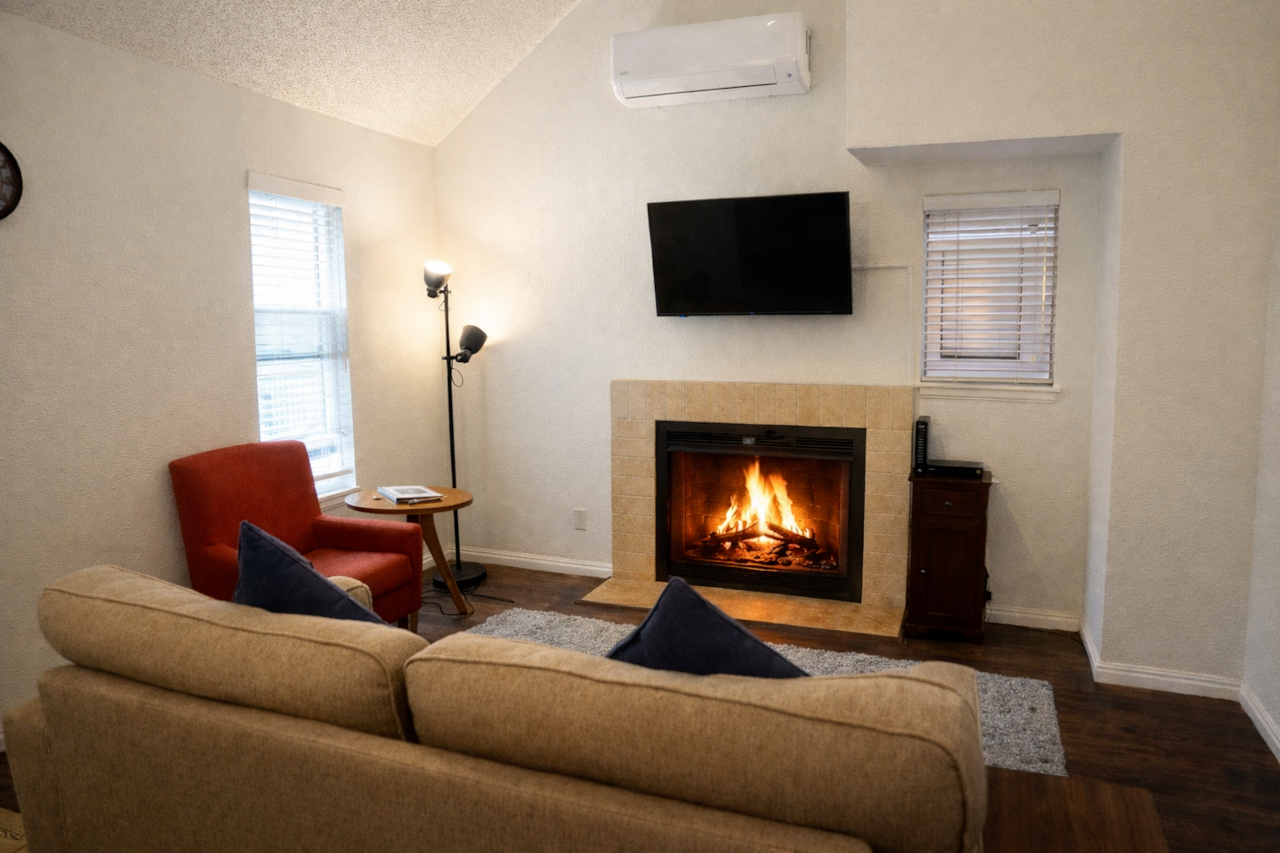Snuggle up by the real fireplace! Just bring your own firewood and you’re all set.
