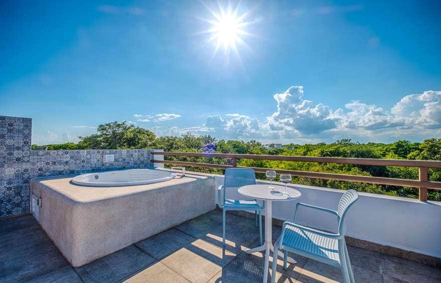 Sunset over the Mayan jungle from the rooftop terrace