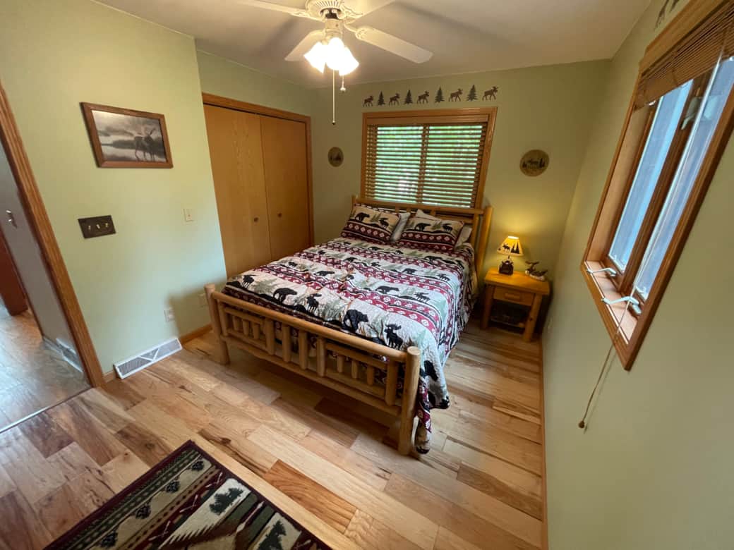 Main floor bedroom with hickory floors and amazing natural light