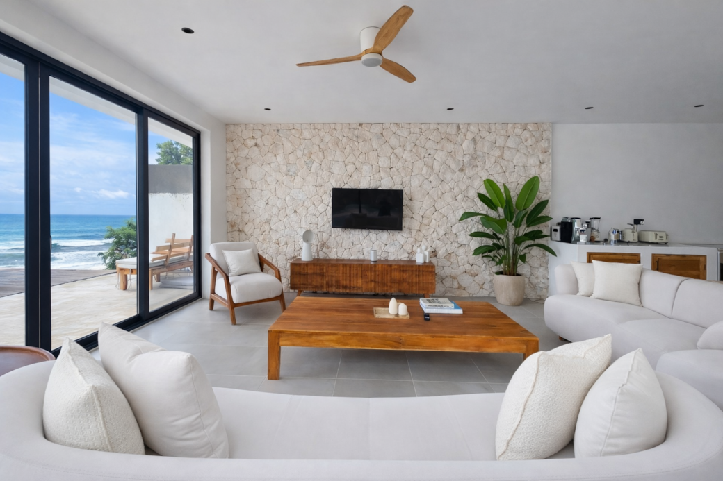 Elegant living space with natural light and ocean view