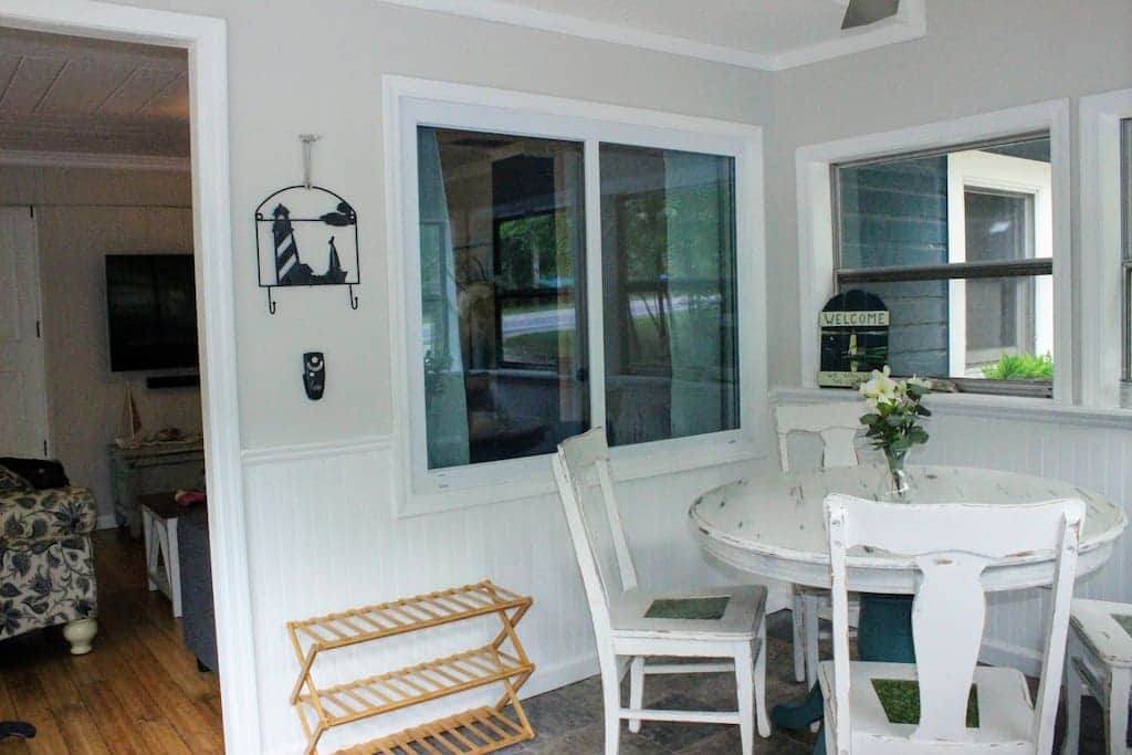 The front porch offers a great space for playing cards or board games.