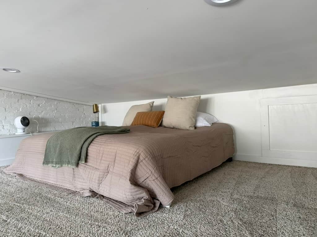 Cozy loft with two twins combined as a king. Soft linens, airy feel—perfect for relaxing.