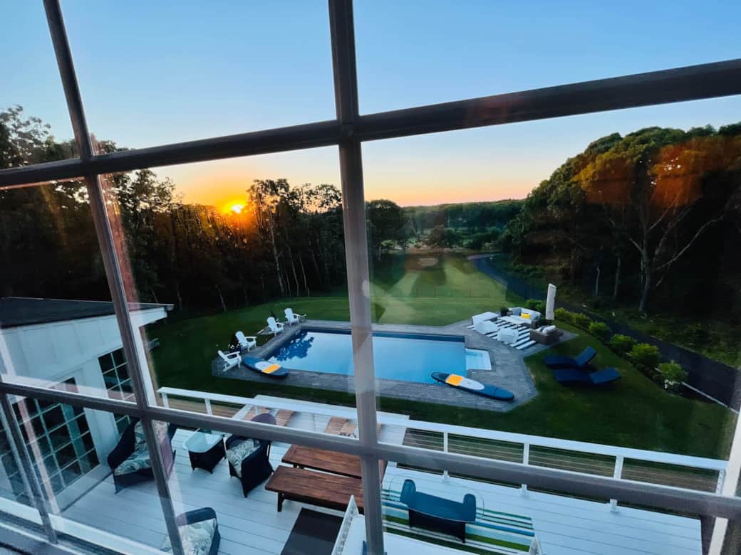 Views from the Sunset Suite window of a gorgeous backyard and golden sunset.