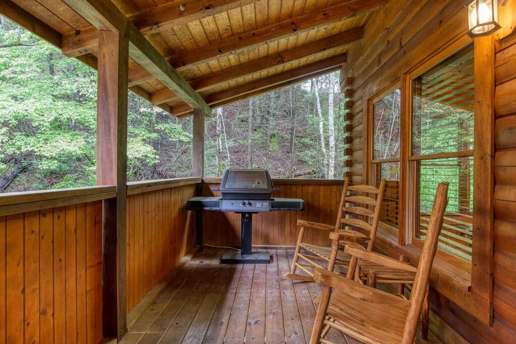 Gas grill on back deck with four rocking chairs. Gas grill on back deck with four rocking chairs.