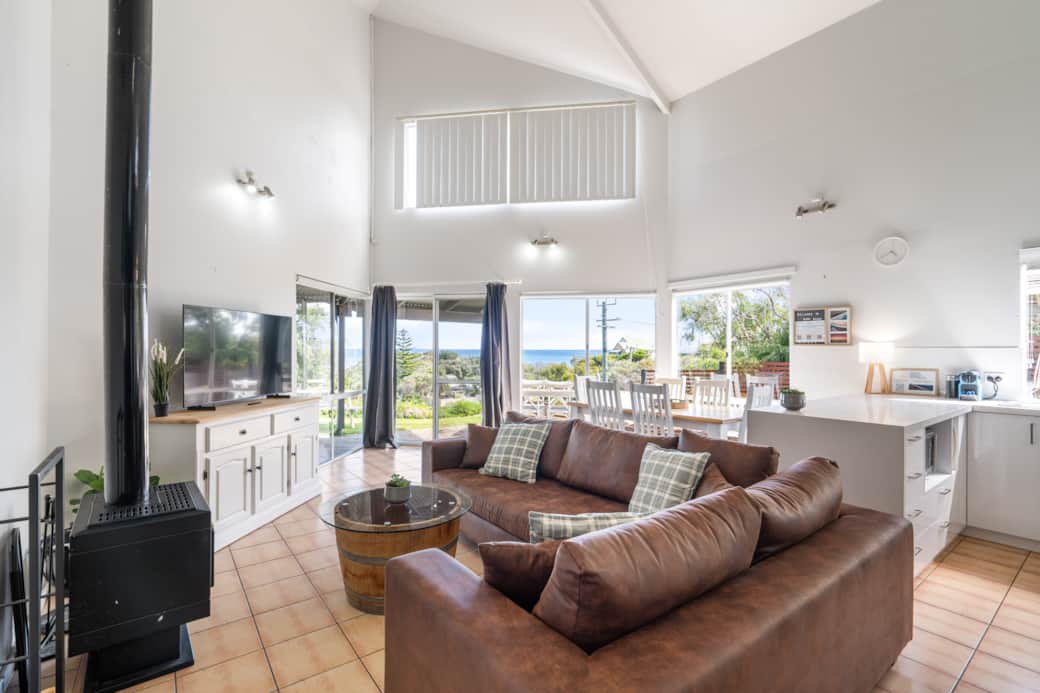 Lounge room with fireplace and ocean views Lounge room with fireplace and ocean views