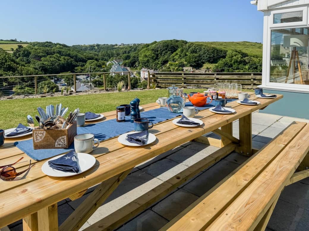 Al fresco dining spot for taking in those wonderful views. 
This huge bespoke table and benches was made by a local craftsman and easily seats 12. 