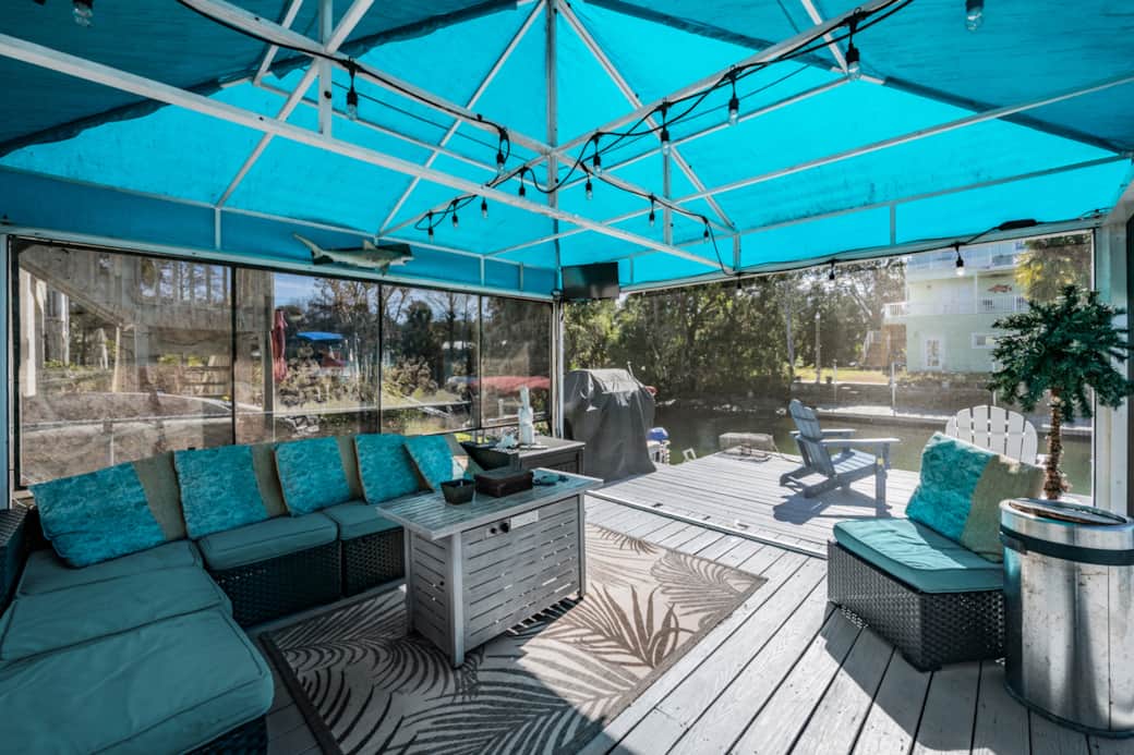 Escape to your private screened gazebo — the perfect spot to relax and enjoy bug-free water views