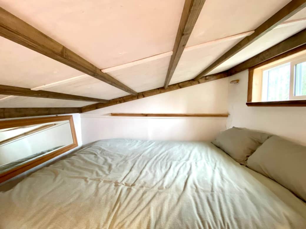 Bed in loft - the mirror allows you to see out the window while in bed! Bed in loft - the mirror allows you to see out the window while in bed!