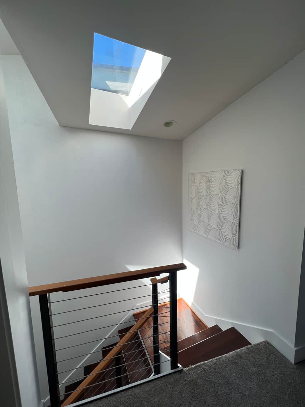 Main bedroom stairs with skylights 