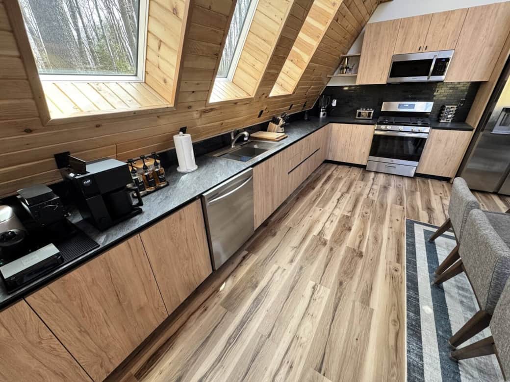 Fully modern and stocked kitchen, complete with plates, cups, mugs, wine glasses, toasters, blenders, AirFryer and much more. All the things you will need to bring home to the woods!