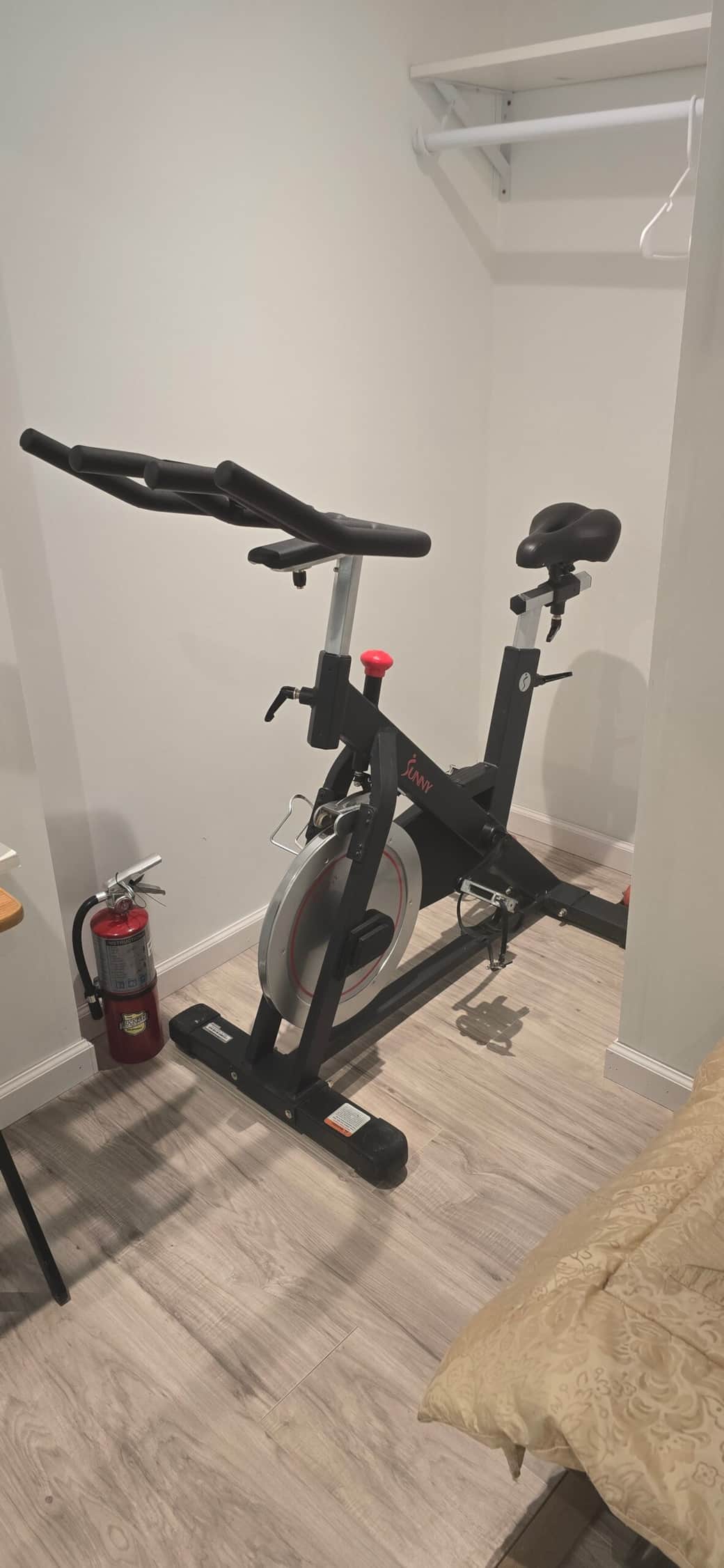Exercise bike inside your private room, closet space above.