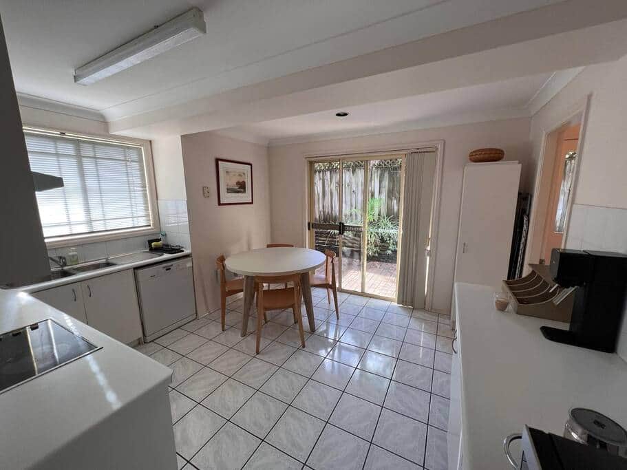 Kitchen with access to rear courtyard Kitchen with access to rear courtyard