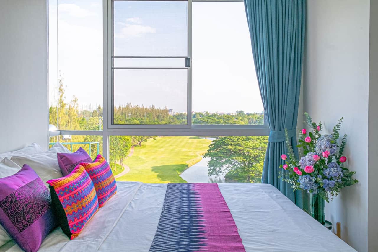 The Queen bed features Pha Sinh, a hand-woven fabric traditionally used as a woman's dress.
