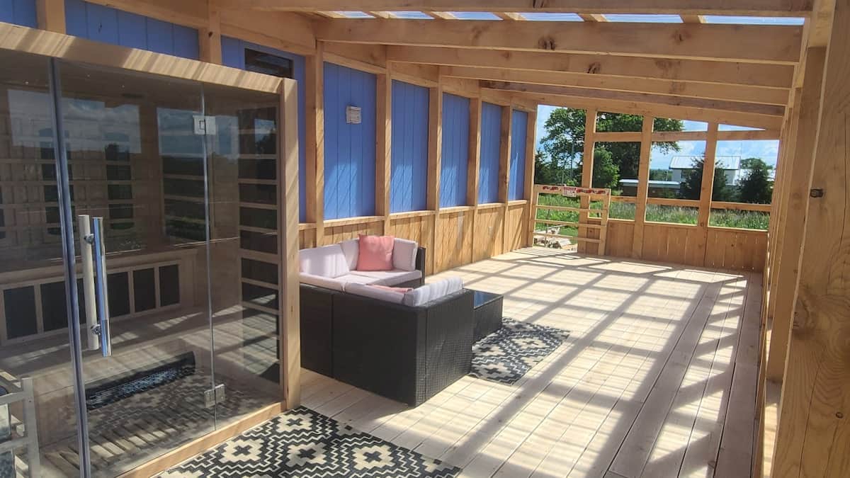 timber-framed sunroom with sauna and sitting area!