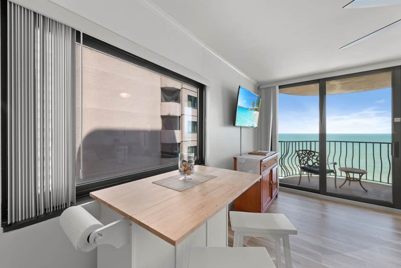 Oceanfront breakfast bar with balcony views — the perfect spot to sip your morning coffee and soak in the sea breeze. ☕