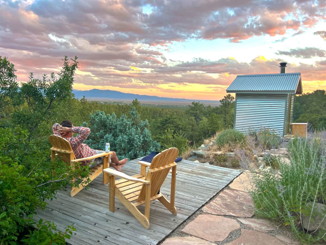 Sit outside at Sunset over the Taos, NM mesa at Casa Saudade - Taos Earthship vacation rental