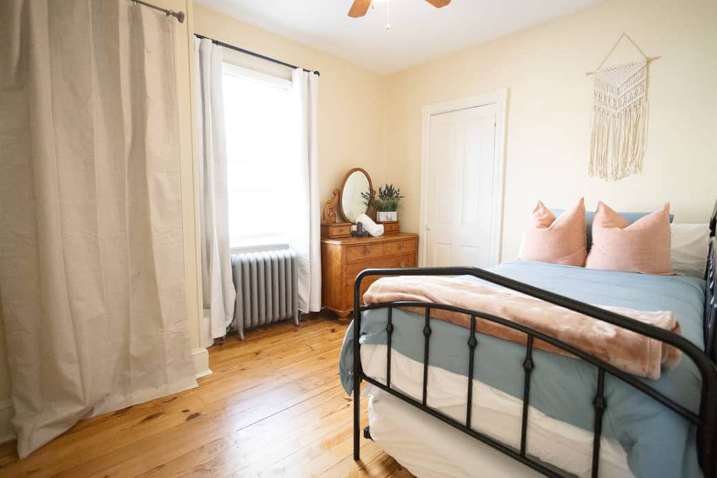 
A peaceful guest retreat with light tones, natural wood floors, and vintage touches. Crisp linens, soft throws, and plenty of natural light make it a relaxing place to wake up.