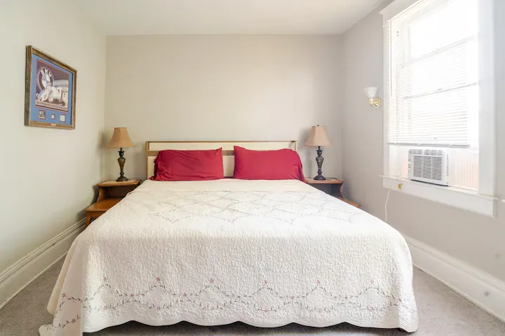 Bedroom Retreat: Bright room with plush bedding and inviting decor, perfect for restful nights! Bedroom Retreat: Bright room with plush bedding and inviting decor, perfect for restful nights!